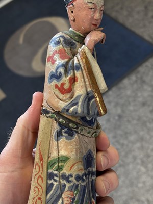Lot 67 - A PAIR OF CHINESE POLYCHROME-DECORATED TERRACOTTA FIGURES