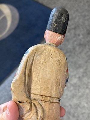 Lot 67 - A PAIR OF CHINESE POLYCHROME-DECORATED TERRACOTTA FIGURES