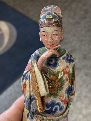Lot 67 - A PAIR OF CHINESE POLYCHROME-DECORATED TERRACOTTA FIGURES