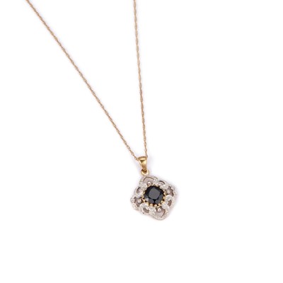 Lot 432 - A 9 CARAT GOLD SAPPHIRE AND DIAMOND PENDANT ON CHAIN