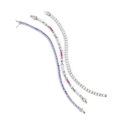 Lot 436 - THREE GEM-SET TENNIS BRACELETS