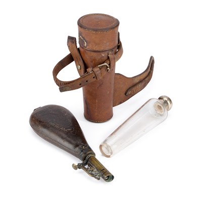 Lot 8 - A 19TH CENTURY BRASS-MOUNTED STAMPED LEATHER SHOT FLASK
