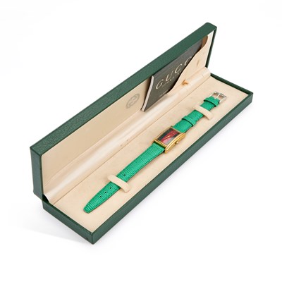 Lot 374 - A LADY'S GOLD PLATED GUCCI STRAP WATCH