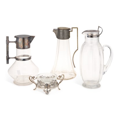 Lot 241 - THREE SILVER-PLATE MOUNTED GLASS CLARET JUGS