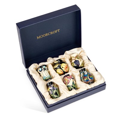 Lot 104 - A SET OF SIX MOORCROFT POTTERY MINIATURE VASES