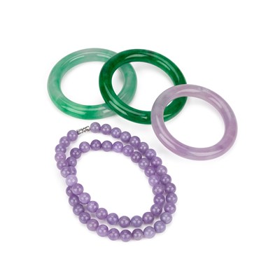 Lot 133 - THREE CHINESE JADE BANGLES AND A STRING OF BEADS