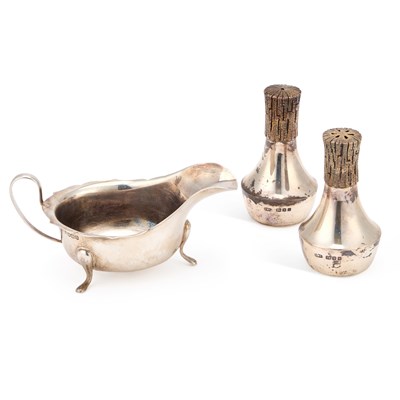 Lot 268 - A PAIR OF ELIZABETH II SILVER AND PARCEL-GILT SALT AND PEPPER POTS