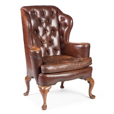 Lot 746 - A GEORGIAN STYLE BROWN LEATHER AND WALNUT WING-BACK ARMCHAIR