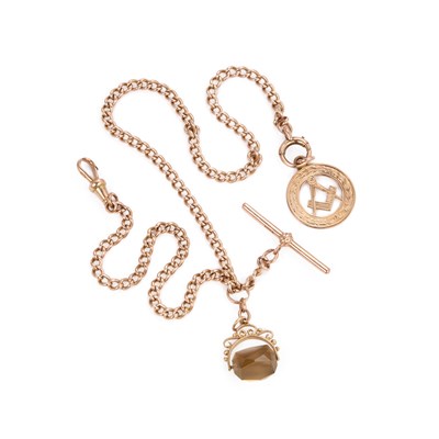 Lot 487 - A CURB LINK ALBERT CHAIN WITH SMOKY QUARTZ SWIVEL FOB, MASONIC FOB AND 9 CARAT GOLD T-BAR