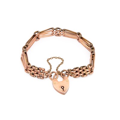 Lot 480 - A 9 CARAT ROSE GOLD GATE LINK BRACELET WITH HEART PADLOCK CLASP