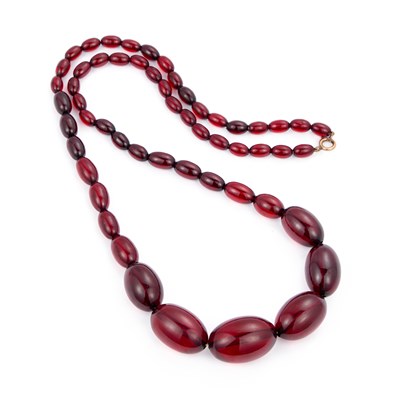 Lot 530 - A PRYSTAL CHERRY AMBER BAKELITE BEAD NECKLACE