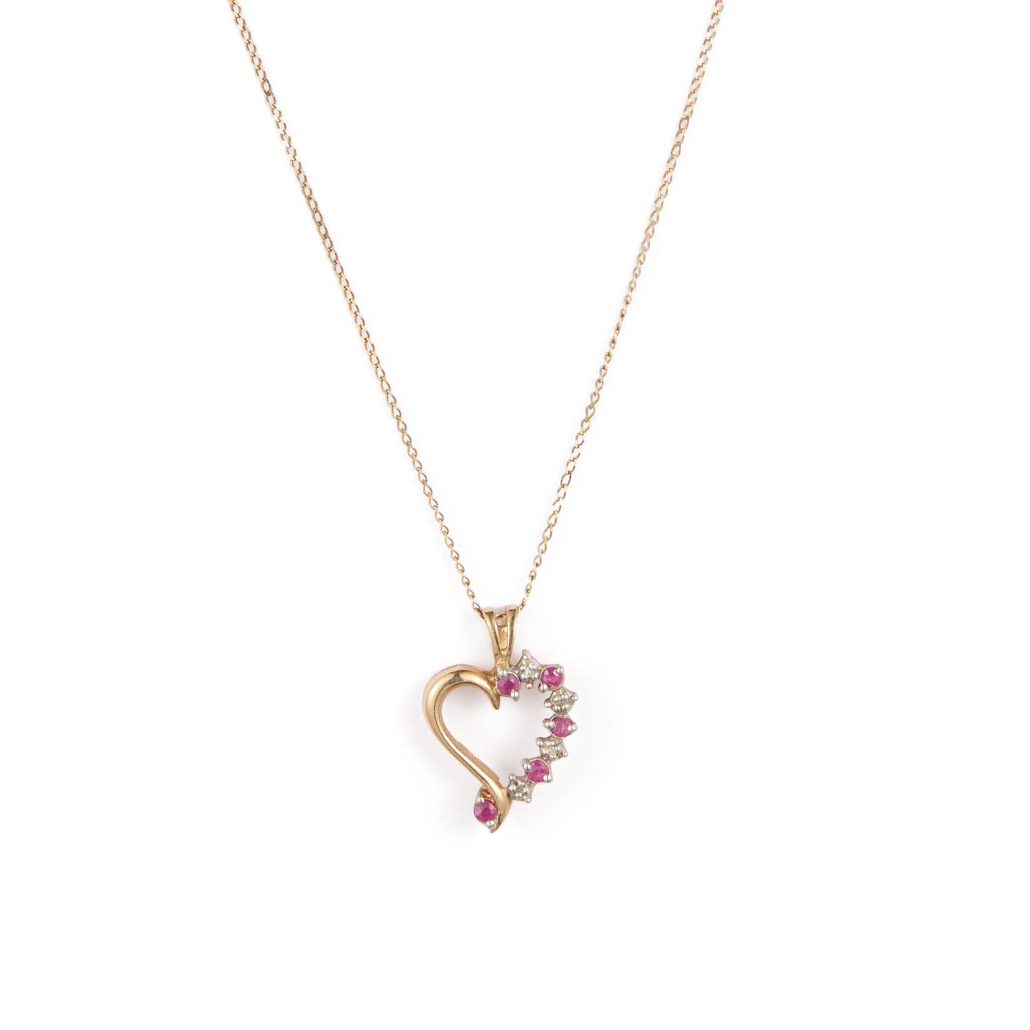 Lot 918 - A 9 CARAT GOLD RUBY AND DIAMOND HEART PENDANT ON CHAIN
