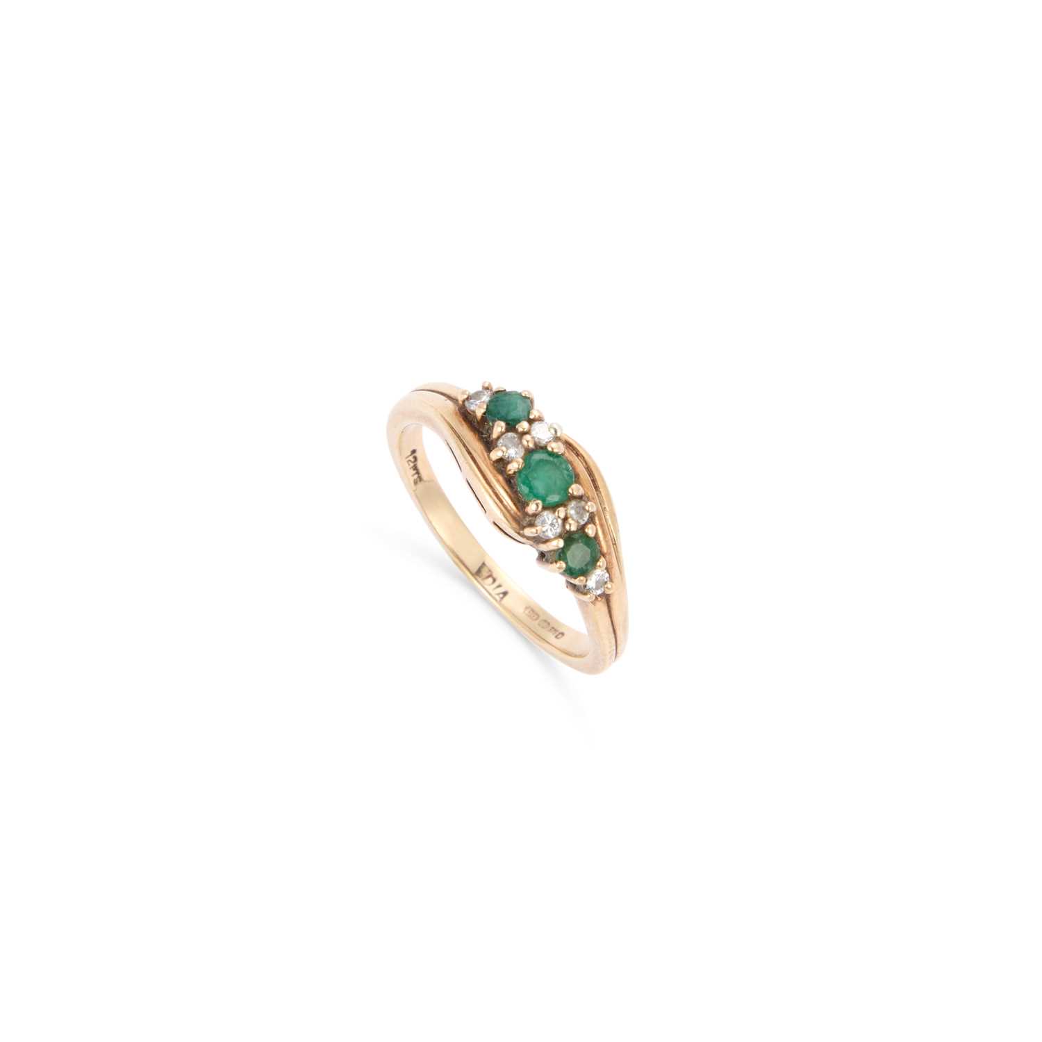 Lot 827 - A 9 CARAT GOLD EMERALD AND DIAMOND RING