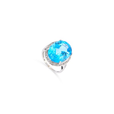 Lot 431 - A 9 CARAT WHITE GOLD BLUE TOPAZ AND DIAMOND CLUSTER RING