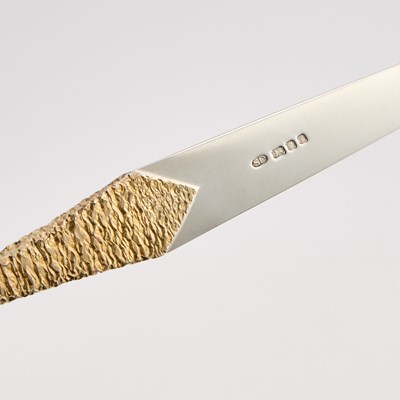 Lot 260 - AN ELIZABETH II PARCEL-GILT SILVER DOUBLE-ENDED LETTER OPENER