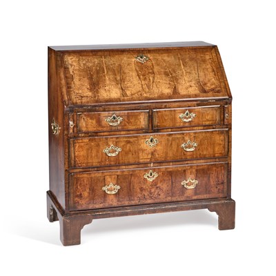 Lot 690 - A GEORGE I FEATHER-BANDED, CROSSBANDED AND WALNUT SLANT-FRONT BUREAU