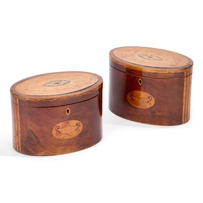 Lot 675 - A PAIR OF GEORGE III SATINWOOD AND MAHOGANY OVAL TEA CADDIES