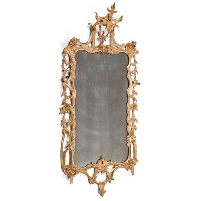 Lot 679 - A GEORGE II STYLE CARVED GILTWOOD WALL MIRROR IN THE ROCOCO TASTE