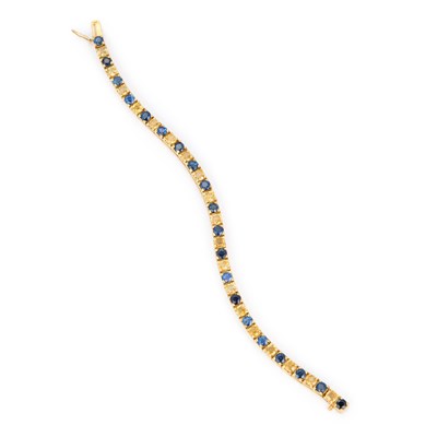 Lot 551 - A BLUE AND YELLOW SAPPHIRE LINE BRACELET