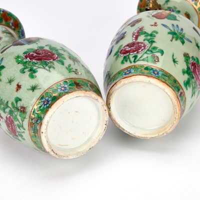 Lot 75 - A NEAR PAIR OF 19TH CENTURY CHINESE FAMILLE ROSE CELADON-GROUND PORCELAIN VASES