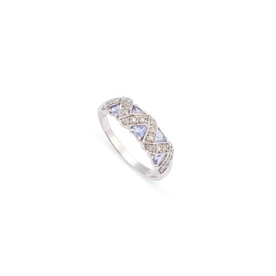 Lot 415 - A 9 CARAT WHITE GOLD TANZANITE AND DIAMOND HALF HOOP RING