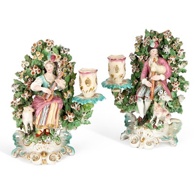 Lot 107 - A PAIR OF 19TH CENTURY CHELSEA DERBY STYLE BOCAGE FIGURAL CANDLESTICKS
