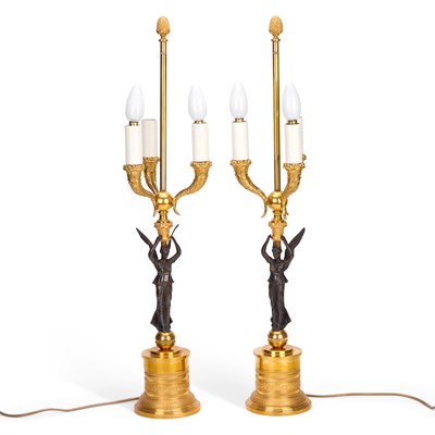 Lot 989 - A PAIR OF BRONZE AND ORMOLU THREE-LIGHT TABLE LAMPS