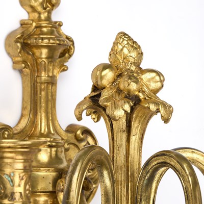Lot 990 - A GOOD SET OF FOUR GILT-BRONZE THREE-LIGHT WALL SCONCES