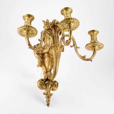 Lot 990 - A GOOD SET OF FOUR GILT-BRONZE THREE-LIGHT WALL SCONCES