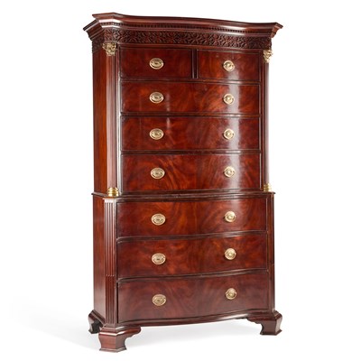 Lot 1054 - A GEORGE III STYLE MAHOGANY SERPENTINE CHEST ON CHEST