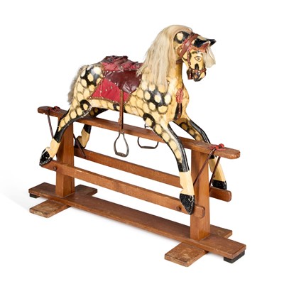 Lot 1015 - A VINTAGE CARVED AND PAINTED WOODEN ROCKING HORSE