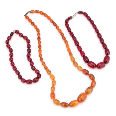 Lot 694 - TWO PRYSTAL CHERRY AMBER BAKELITE NECKLACES