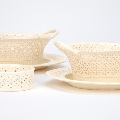 Lot 102 - A PAIR OF LEEDS POTTERY CREAMWARE BASKETS ON STANDS
