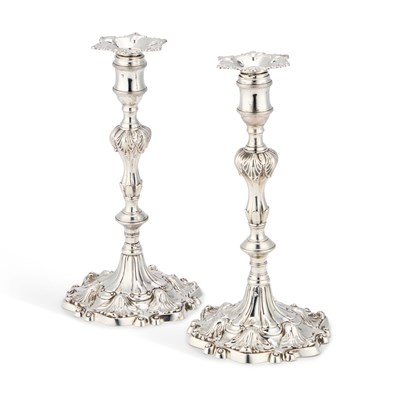 Lot 577 - A PAIR OF GEORGE II CAST SILVER CANDLESTICKS