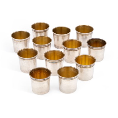 Lot 335 - A SET OF TWELVE FRENCH SILVER SMALL BEAKER CUPS