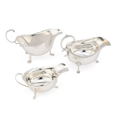 Lot 413 - A GROUP OF THREE SILVER SAUCEBOATS