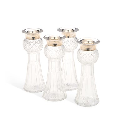 Lot 313 - A SET OF FOUR GEORGE V SILVER-MOUNTED CUT GLASS VASES