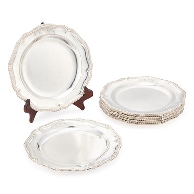 Lot 540 - A FINE SET OF TWELVE GEORGE III SILVER DINNER PLATES