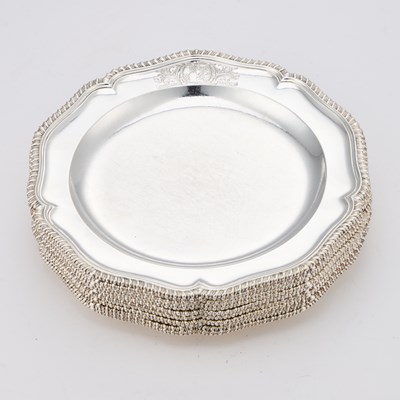 Lot 540 - A FINE SET OF TWELVE GEORGE III SILVER DINNER PLATES