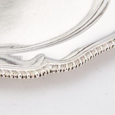 Lot 540 - A FINE SET OF TWELVE GEORGE III SILVER DINNER PLATES
