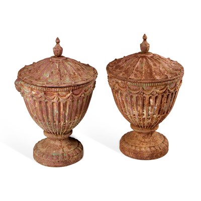 Lot 907 - A PAIR OF ADAM STYLE CAST IRON URNS AND COVERS