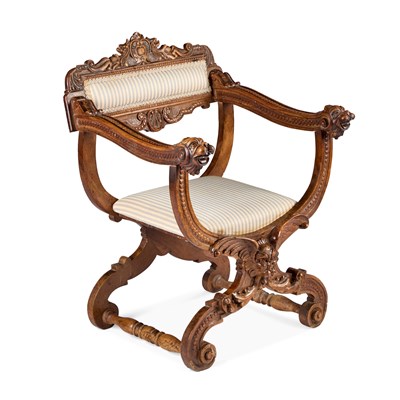 Lot 1031 - A CARVED WALNUT SAVONAROLA CHAIR