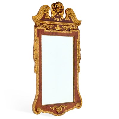 Lot 1071 - A GEORGE II STYLE PARCEL-GILT WALNUT MIRROR