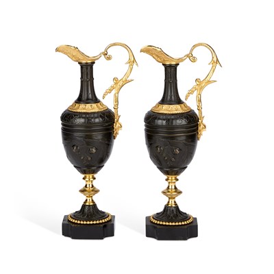 Lot 793 - A PAIR OF BRONZE EWERS