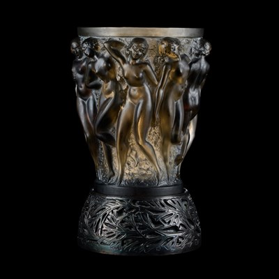 Lot 58 - RENÉ LALIQUE (FRENCH, 1860–1945), A TOPAZ 'BACCHANTES' VASE WITH BRONZE STAND