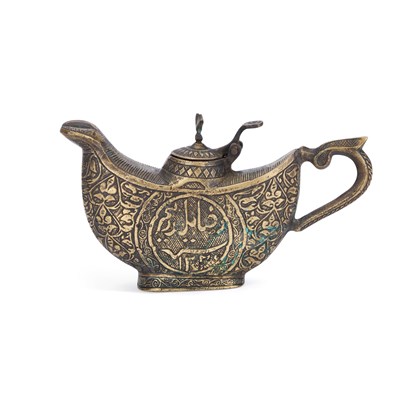 Lot 654 - AN INDO-PERSIAN ENGRAVED BRONZE LAMP