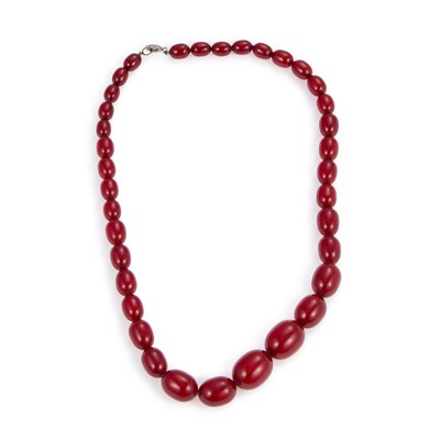 Lot 710 - A CHERRY AMBER BAKELITE BEAD NECKLACE