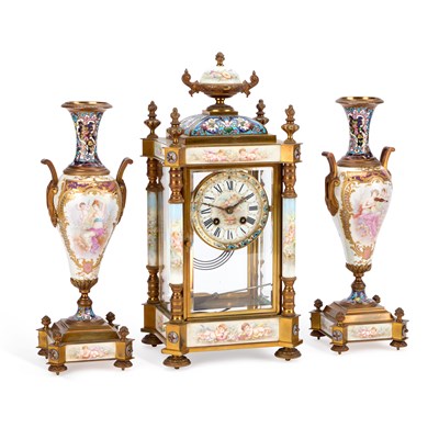 Lot 936 - A FINE FRENCH CHAMPLEVÉ ENAMEL AND PORCELAIN THREE-PIECE CLOCK GARNITURE