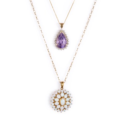 Lot 730 - TWO 9 CARAT GOLD PENDANTS ON CHAINS