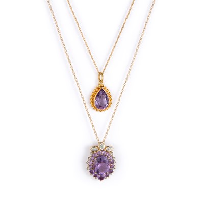 Lot 698 - TWO 9 CARAT GOLD AMETHYST PENDANTS ON CHAINS